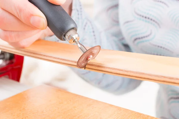 Cutting the batten with rotary saw — Stock Photo, Image