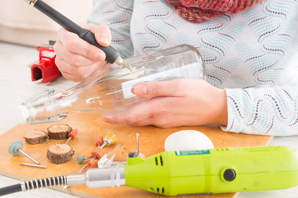 Engraving the bottle with rotary multi tool