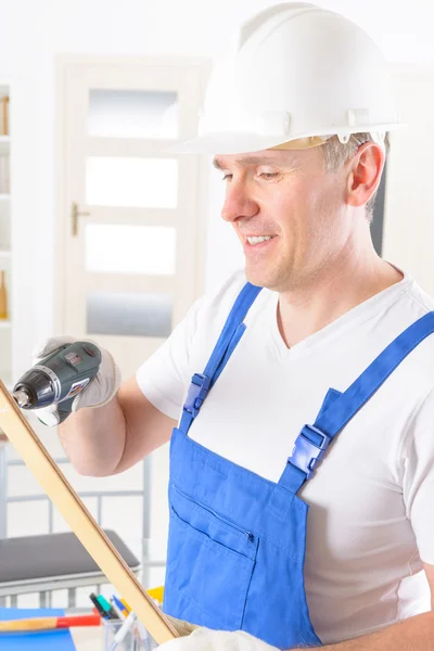Man with wireless electric drill — Stock Photo, Image