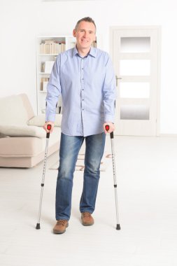 Man with crutches clipart