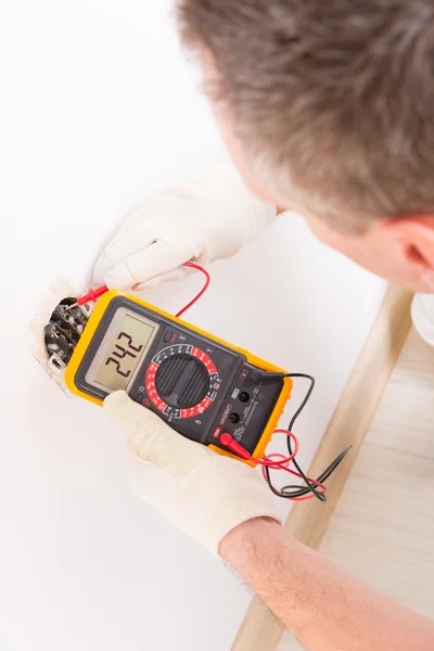 Electrician checking socket — Stock Photo, Image