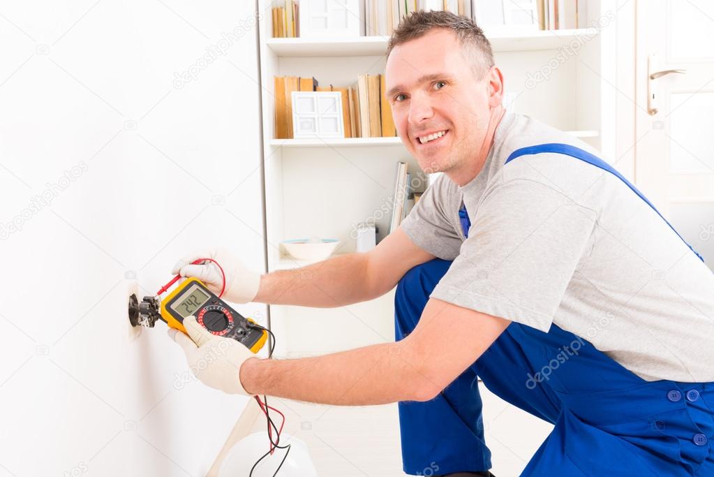 Electrician checking socket