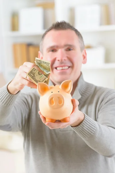 Man saving money — Stock Photo, Image