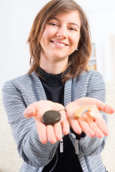 Woman showing cochlear implant — Stock Photo, Image