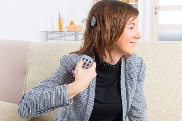 Woman showing cochlear implant — Stock Photo, Image