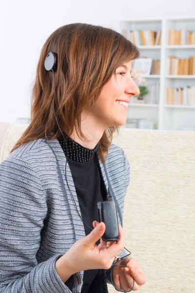 Woman showing cochlear implant — Stock Photo, Image