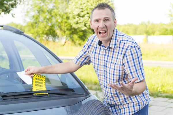 Man with parking ticket — Stockfoto