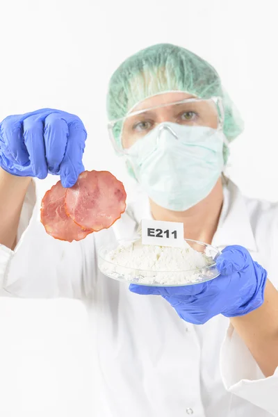 Researcher with food and preservatives — Stock Photo, Image