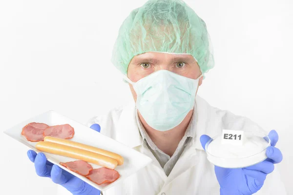 Researcher with food and preservatives — Stock Photo, Image