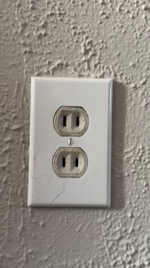 two white electrical outlet in the room.