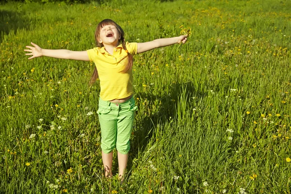 Happy girl with dandelions — Stock Photo, Image