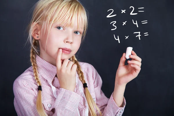 Schoolchild on blackboard background — Stock Photo, Image