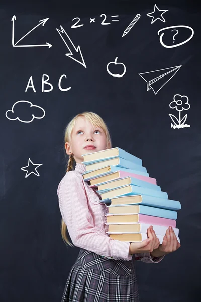 Schoolchild on blackboard background — Stock Photo, Image