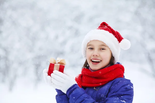 Teenage girl with a gift in their hands — Stock Photo, Image