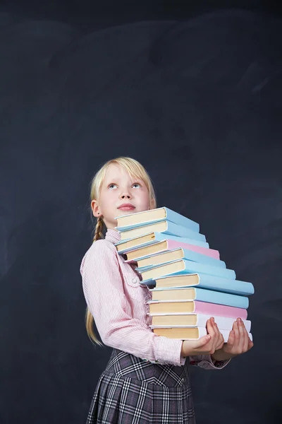 Schoolchild on blackboard background — Stock Photo, Image