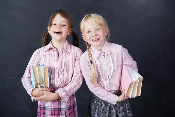 Schoolchild on blackboard background — Stock Photo, Image