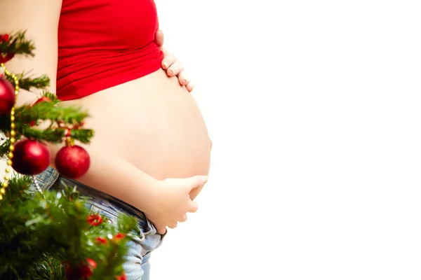 Donna incinta vicino all'albero di Natale — Foto Stock