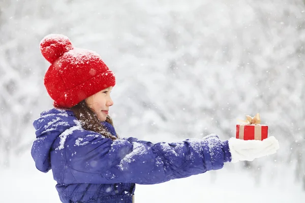 Teenage girl with a gift in their hands — Stock Photo, Image