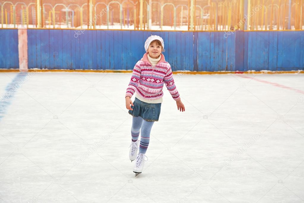 girl ice skating on rink
