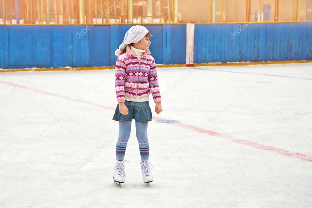 girl ice skating on rink