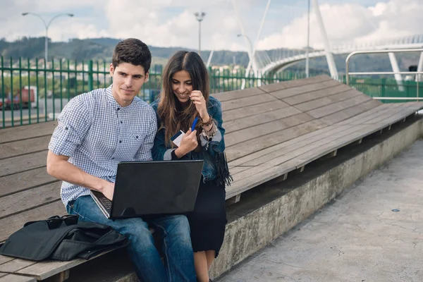 Couple using and looking a laptop — Stock Photo, Image