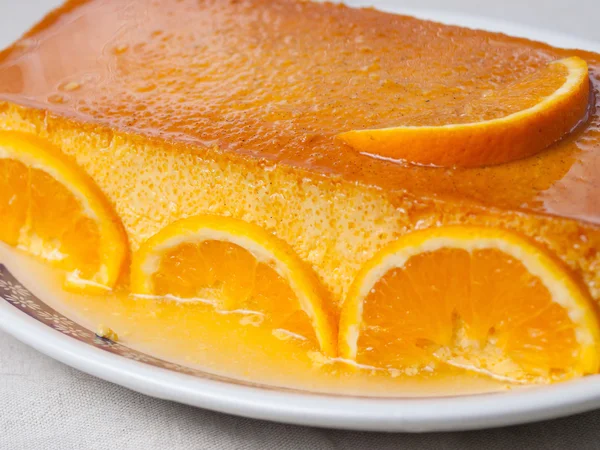 Orange custard in a studio shot. — Stock Photo, Image