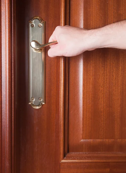 Hand gripping the handle of a door — Stock Photo, Image