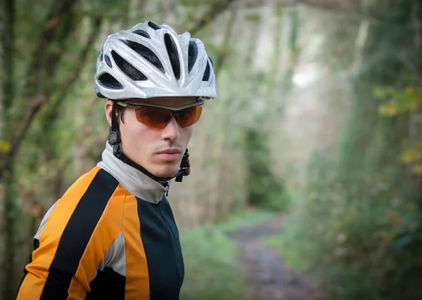 Cyclist portrait in the forest — Stock Photo, Image