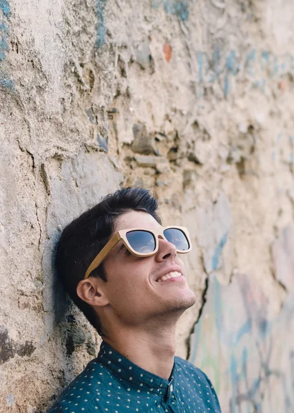 Fashionable man portrait over ruinous wall — Stock Photo, Image