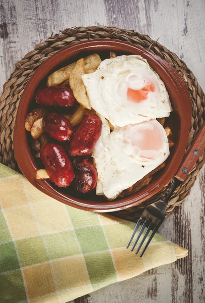 Eggs with french fries and small sausages — Stock Photo, Image