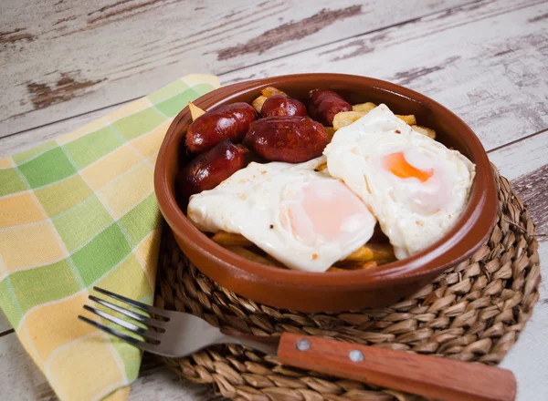 Eggs with french fries and small sausages — Stock Photo, Image