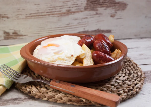 Eggs with french fries and small sausages. — Stock Photo, Image