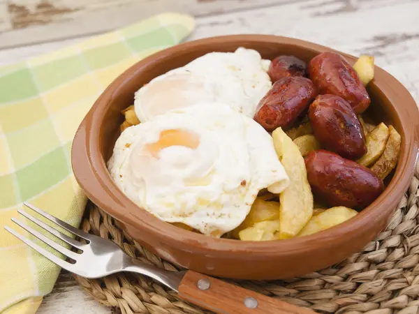 Eggs with french fries and small sausages. — Stock Photo, Image