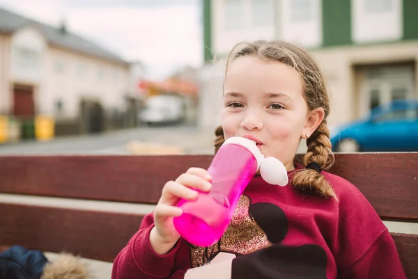 Little blonde girl drinking water — Stock Photo, Image