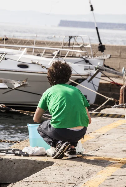 Muggia,young fisherman — Stok fotoğraf