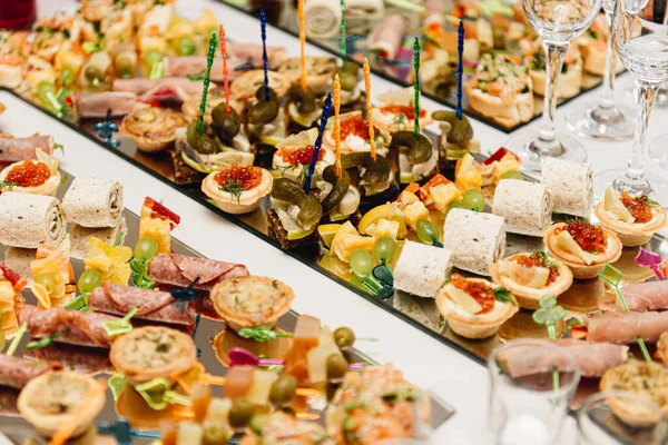 Beautifully Decorated Catering Banquet Table Burgers Profiteroles Salads Cold Snacks — Stock Photo, Image