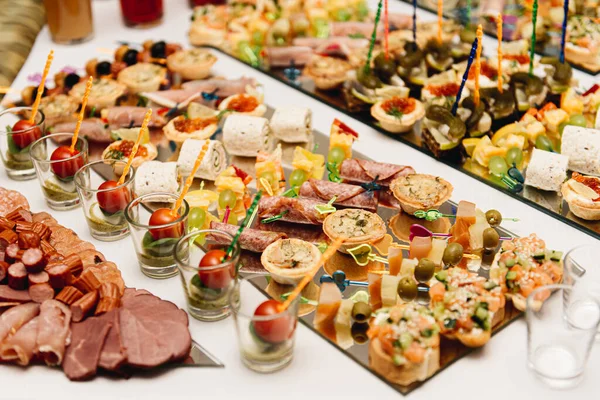 Beautifully Decorated Catering Banquet Table Burgers Profiteroles Salads Cold Snacks — Stock Photo, Image