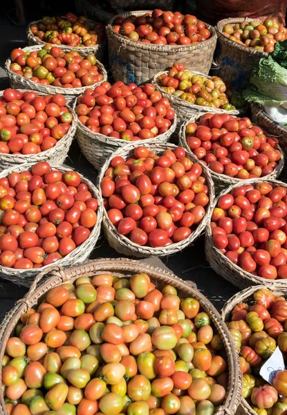 Tomatoes in baskets, street market in Mandalay, Myanmar, Asia