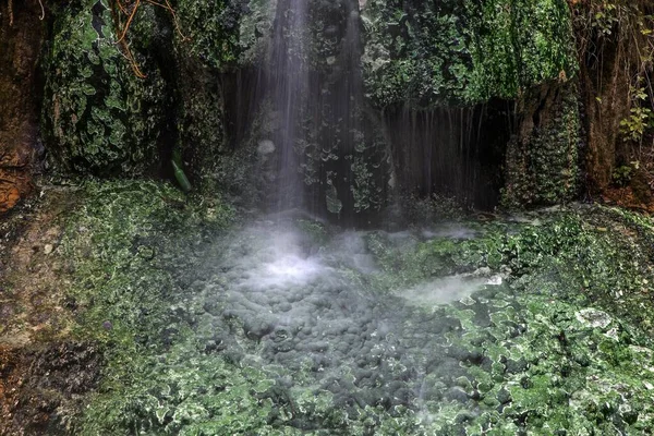 Small waterfall with green mineral deposits, hot springs of Bagni San Filippo, Castiglione d'Orcia, Tuscany, Italy, Europe