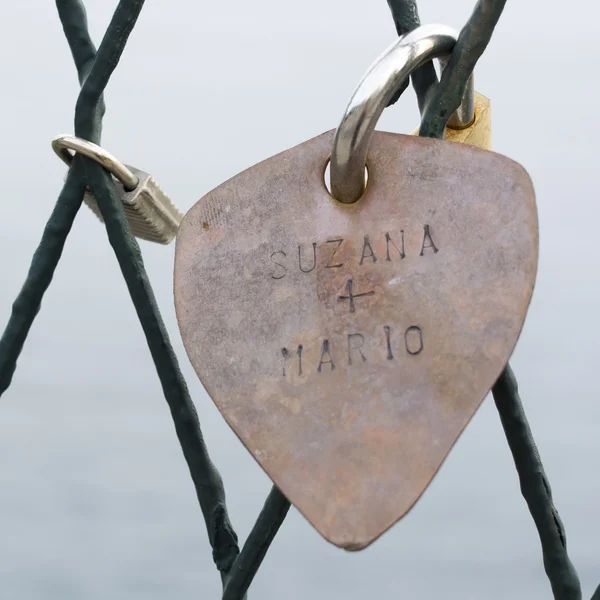 Padlock in shape of heart to tell love. — Stock Photo, Image