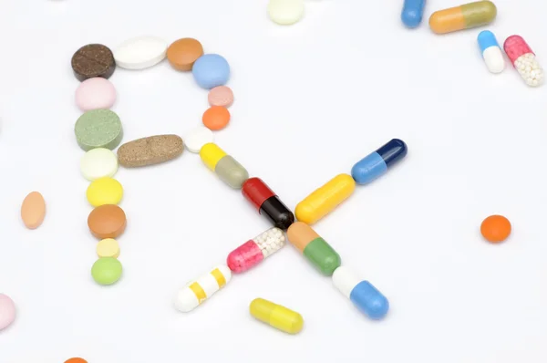 Símbolo de prescrição Rx feito de drogas — Fotografia de Stock