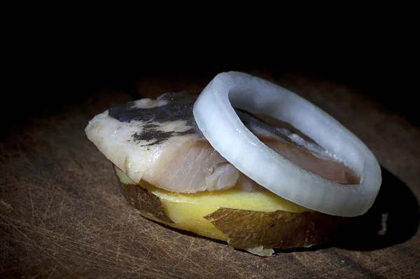 Salted herring on boiled potato — Stock Photo, Image