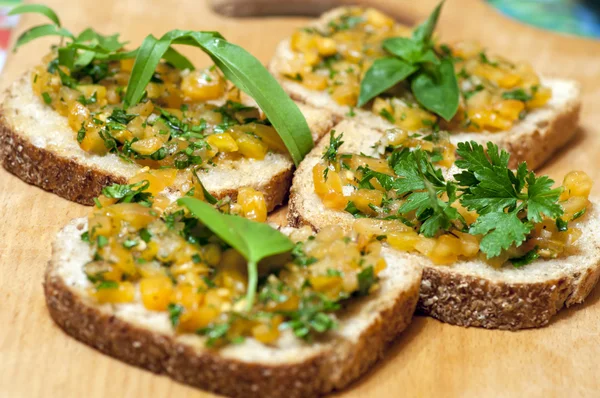 Italian bruschetta with yellow tomatoes — Stock Photo, Image