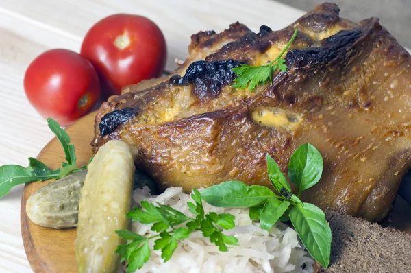 Roasted pork leg served with sauerkraut — Stock Photo, Image