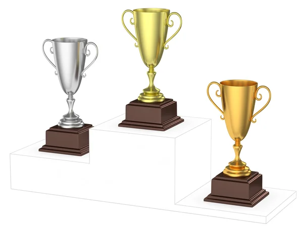 Golden, silver and bronze trophy cups on imaginary winners podiu — Stock Photo, Image