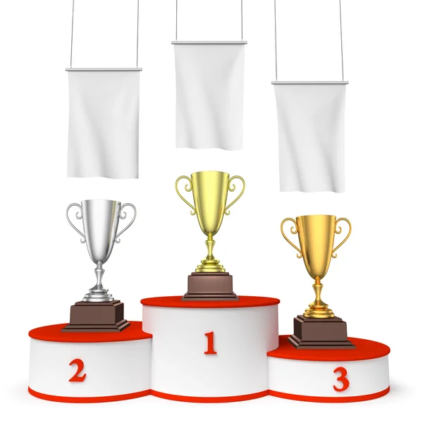 Round winners podium with trophy cups and blank white flags — Stock Photo, Image