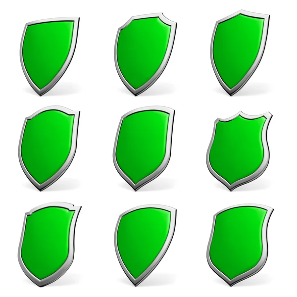 Зеленый щиты на белый комплект — стоковое фото