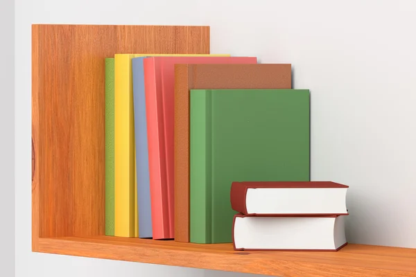 Colored books on wooden bookshelf on white wall — Stock Photo, Image