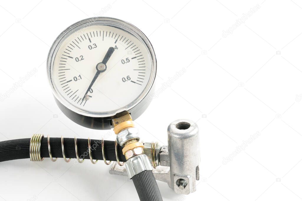 Pressure gauge for measuring air pressure in automobile tires close-up on an isolated white background