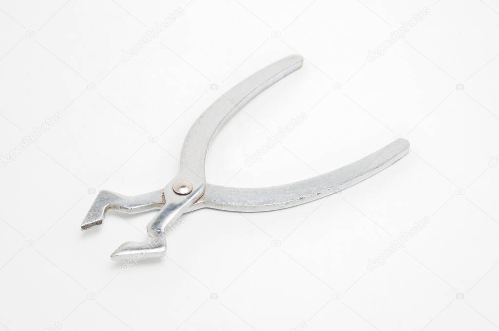 Metal sugar cutters on isolated white backgroun